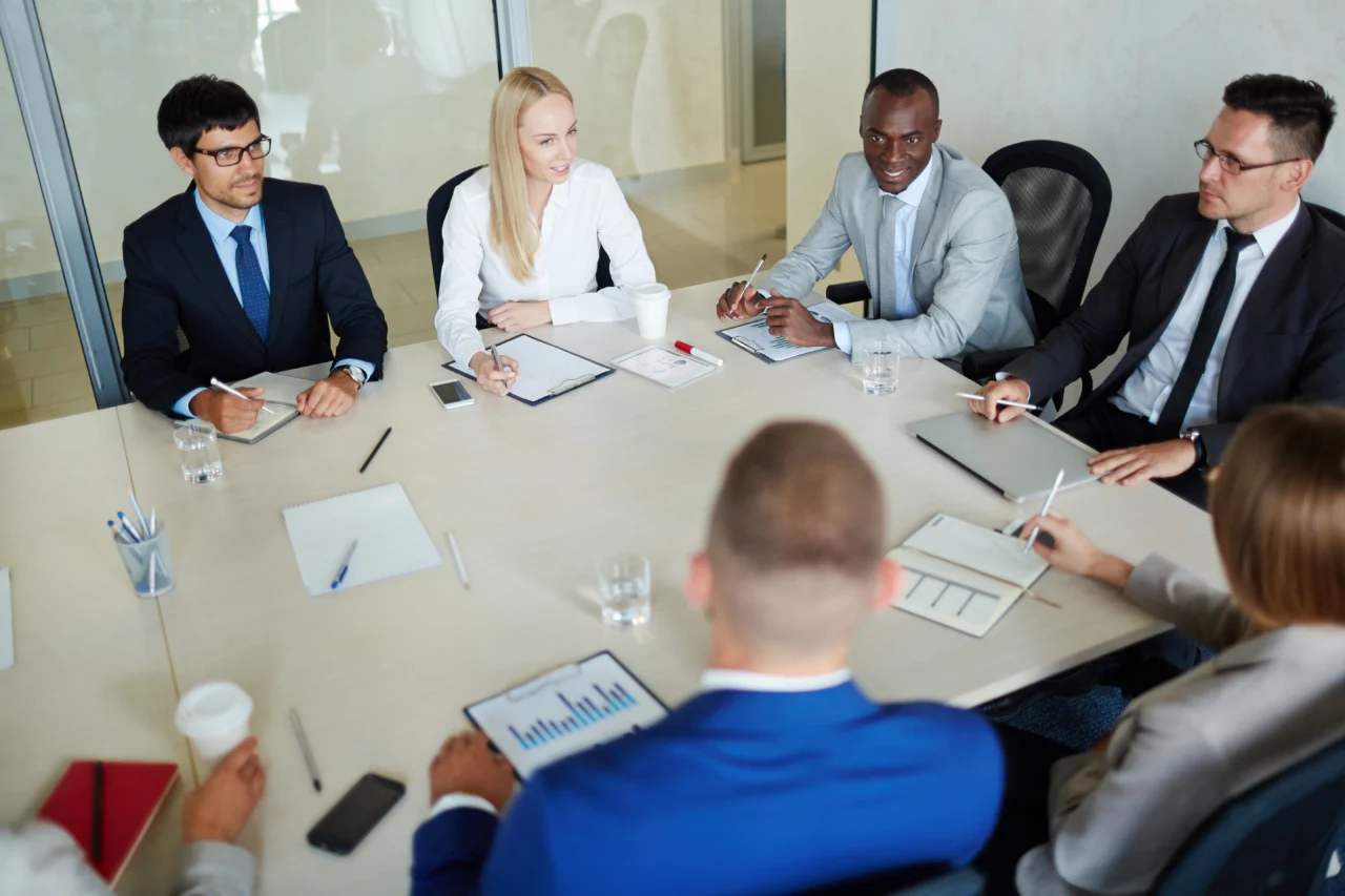 Colleagues discussing KPIs at work table