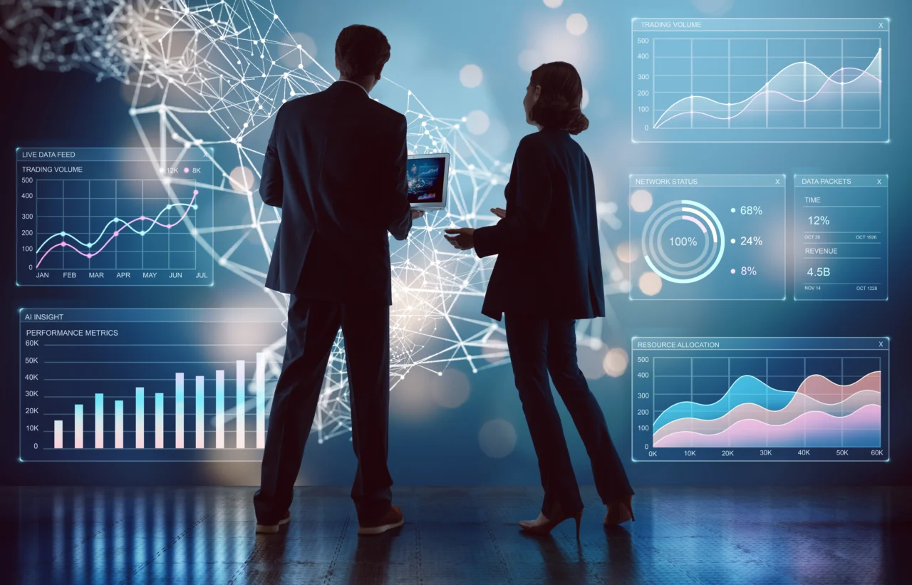 Two professionals looking at a screen of employee relations data